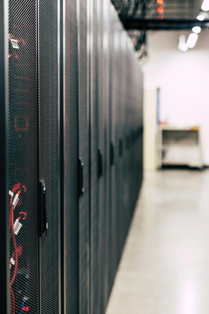 pexels photo 5408005 5408005 High-tech data center featuring multiple server racks with advanced equipment.